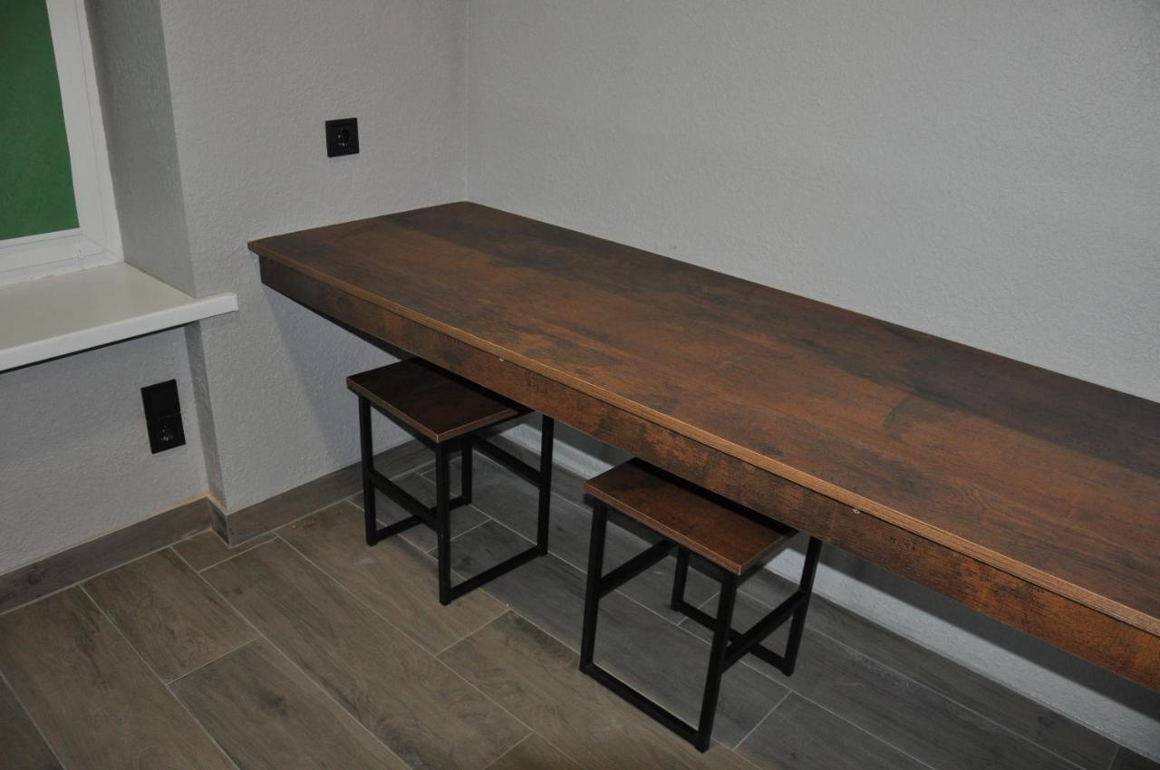 Full House Capsule Hostel Rivne Exterior photo A bar table